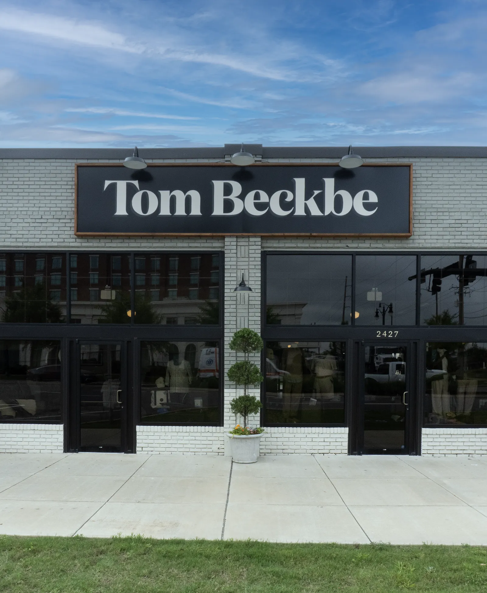 Hand-painted Tom Beckbe storefront sign in Tuscaloosa, Alabama